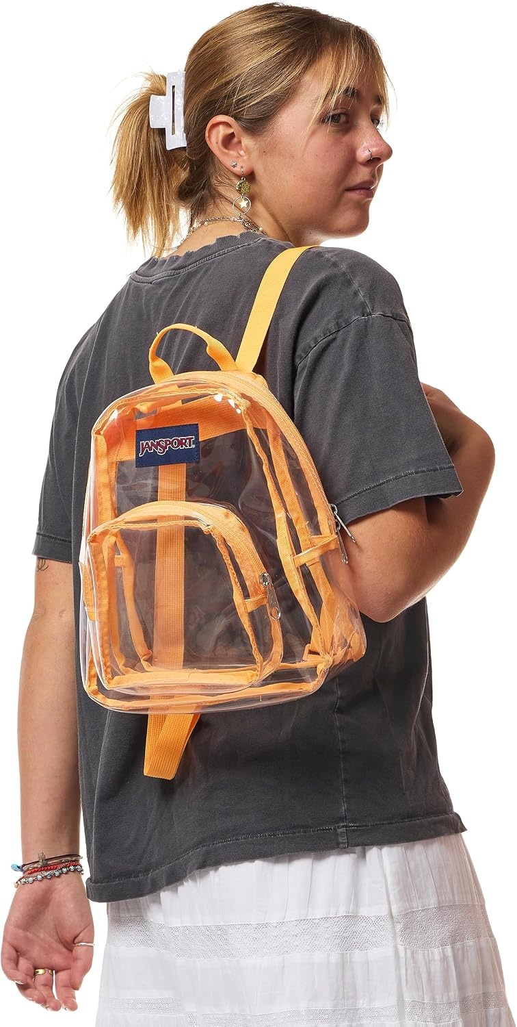 image:imageJanSport Mini Pack Lightweight 10L Backpack with Adjustable Straps and Front Zipper Pocket Perfect for Travel Concerts amp Everyday Use ClearOrange Soda