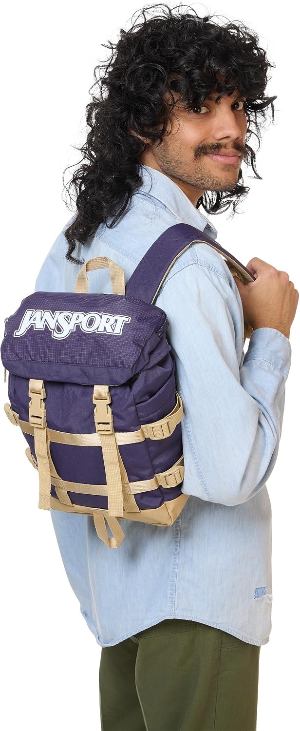 image:imageJanSport Mini Skip Pack Compact Backpack with Main Compartment Side Water Bottle Pocket and Zippered Accessory Pocket TravertineAmethyst Angst