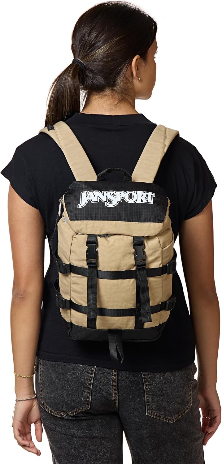 image:imageJanSport Mini Skip Pack Compact Backpack with Main Compartment Side Water Bottle Pocket and Zippered Accessory Pocket TravertineTravertine